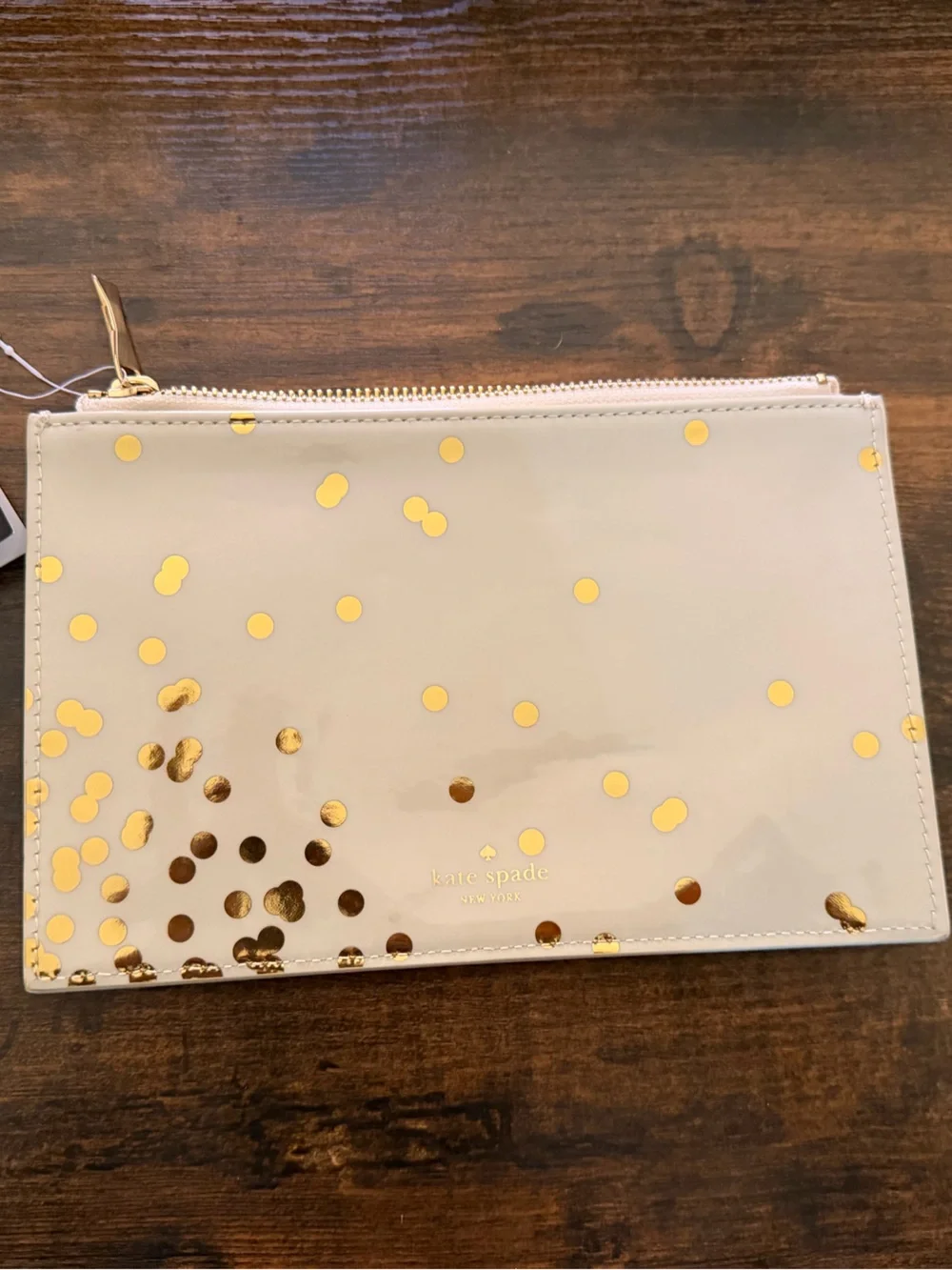 kate spade beige patent pouch with metallic gold polka dots